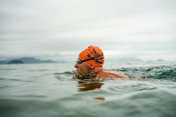 Open water swimmer wearing goggles in the ocean