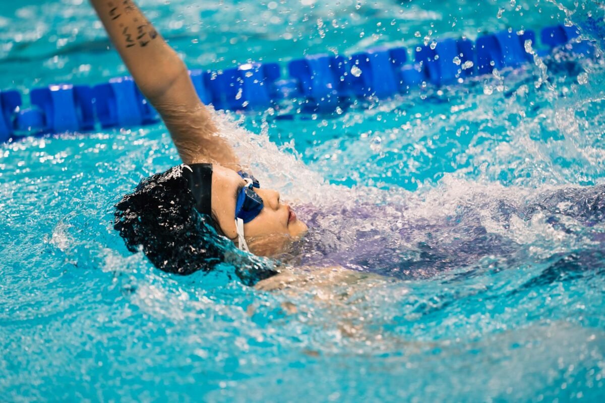 Competitive swimmer wearing goggles during training in 2026