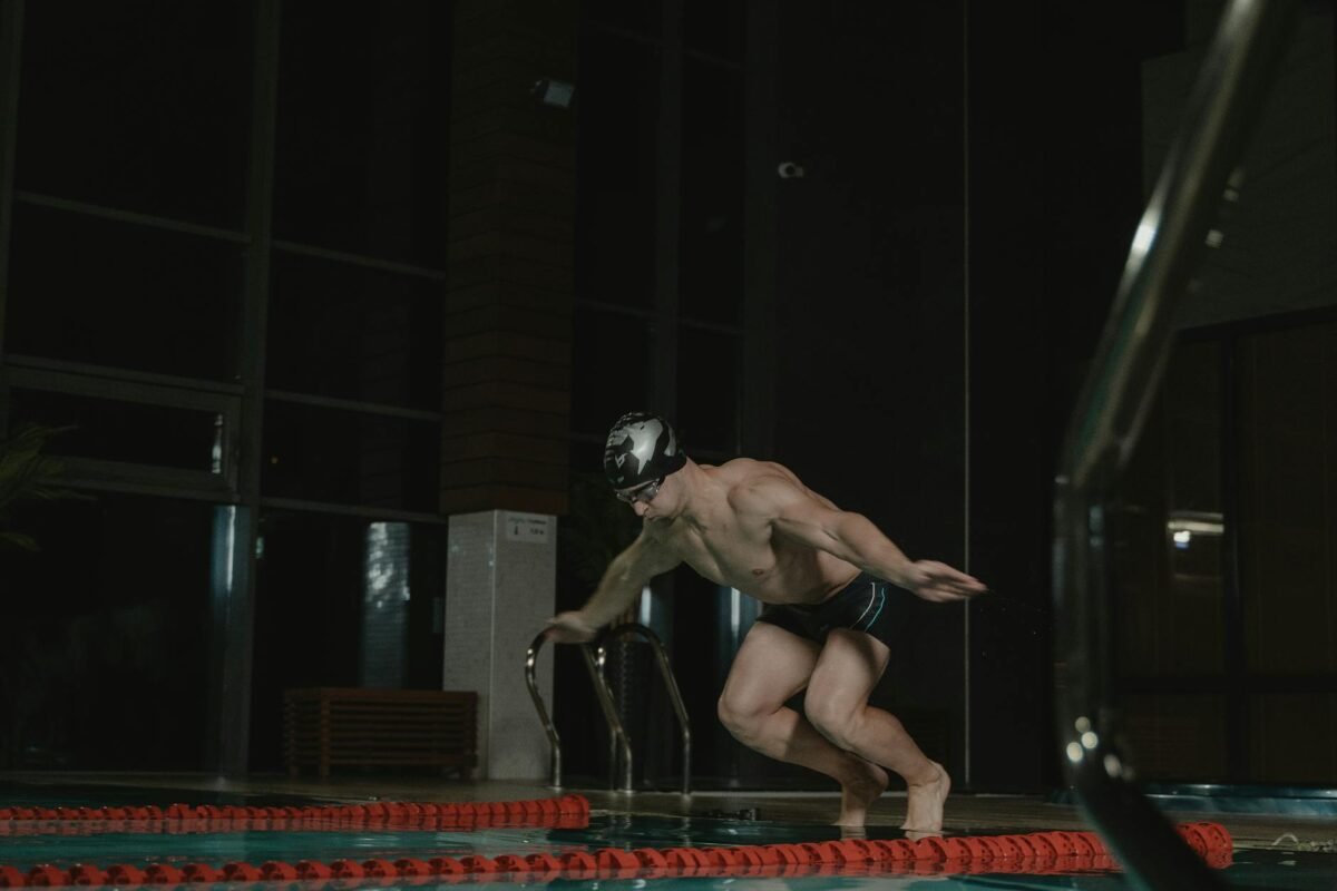 Freestyle swimmer wearing low-profile racing goggles in the pool