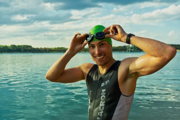 Triathlon swimmer wearing goggles in open water