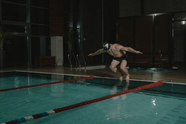 Swimmer doing dryland jump training to improve swim turns