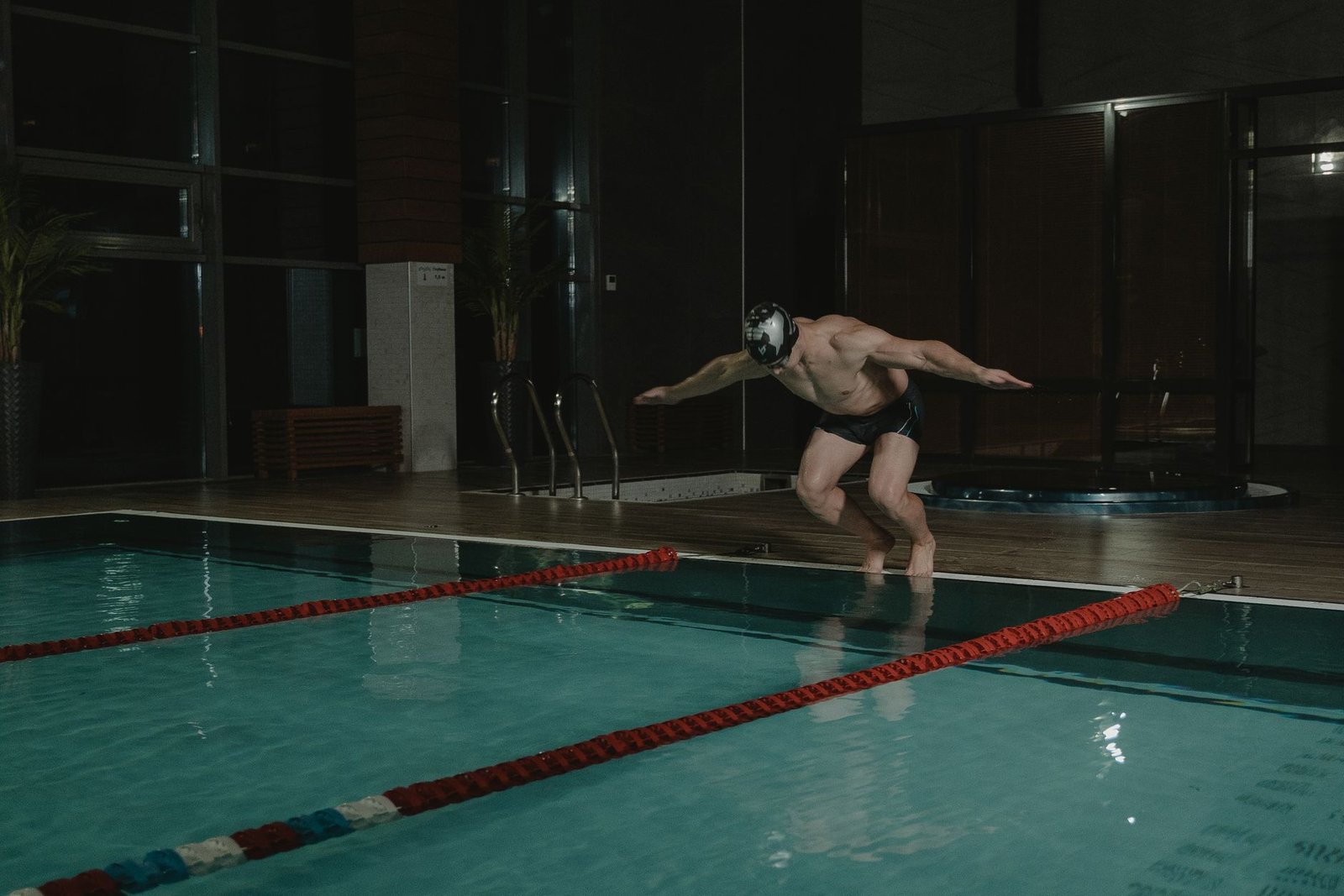 Swimmer doing dryland jump training to improve swim turns