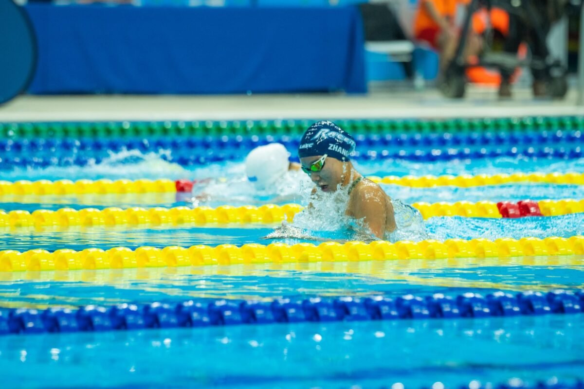 Swimmer training individual medley in a pool