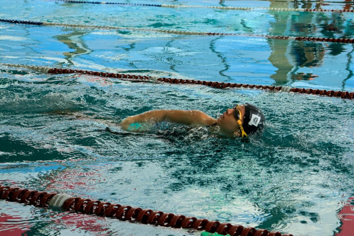 Swimmer wearing swim goggles during pool training